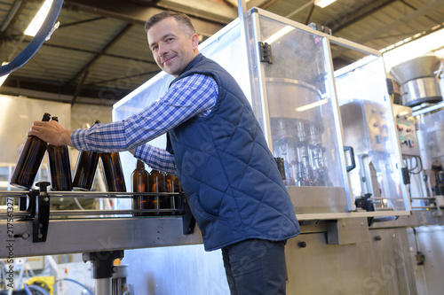 bottled glass factory worker