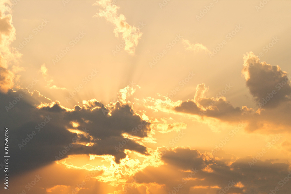 Evening sky with rays from behind the clouds. Sunlight coming from behind the clouds Evening sky with rays from behind the clouds. Sunlight coming from behind the clouds