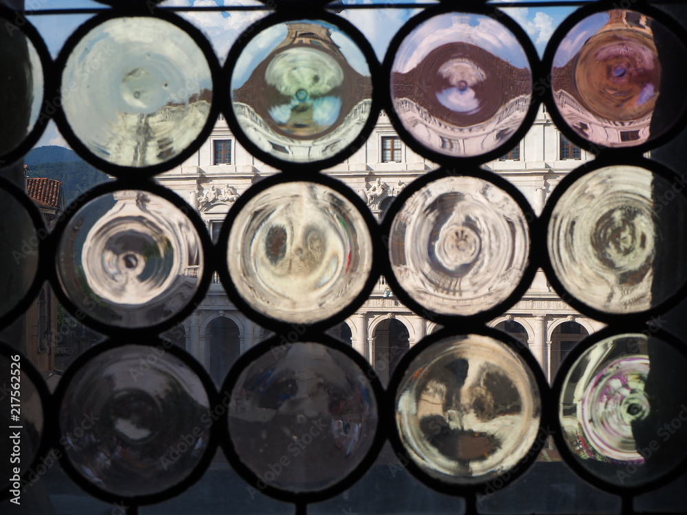 Bergamo, the old town . One of the beautiful city in Italy. Landscape at the public library Angelo Mai through the Venetian windows of the ancient administration building Bergamo, the old town . One of the beautiful city in Italy. Landscape at the public library Angelo Mai through the Venetian windows of the ancient administration building