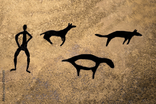 the image of animals and humans on the wall of the cave. ancient art, science, archeology.