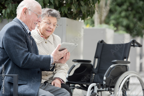 couple in wheelchair outside in nature