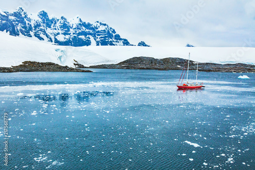 sailing boat in Antarctica, travel by yacht cruise, beautiful remote tourism destination