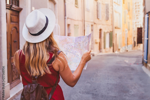 Photography travel to Europe, tourist looking at map on the street, summer holidays sightsee