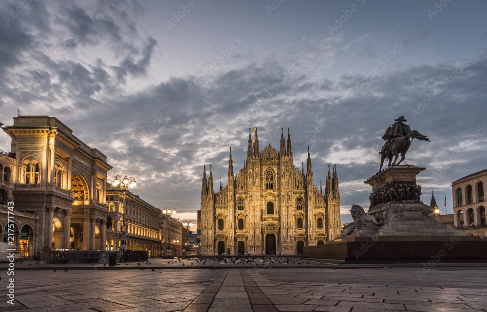 milano piazza duomo cathedral galleria and monument at sunrise cloudy sky