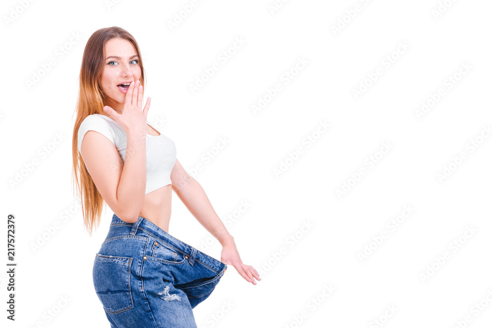 Slim woman back with huge pants and tape isolated on white background.
