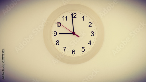 clock on wall showing nine hours