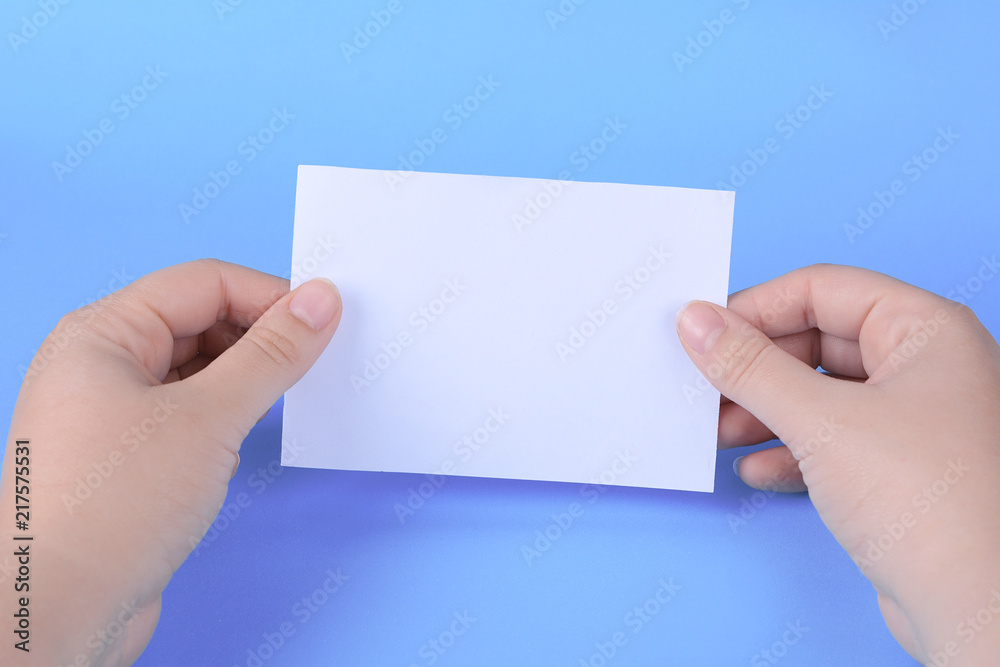 Fototapeta premium Woman hands holding empty note paper