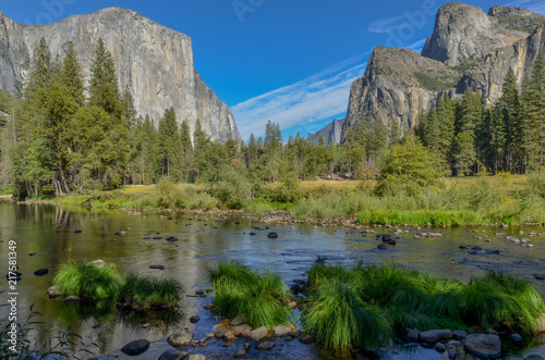 Merced river flowing in Yosemite valley hidden between granite mountains Yosemite National Park, California, USA