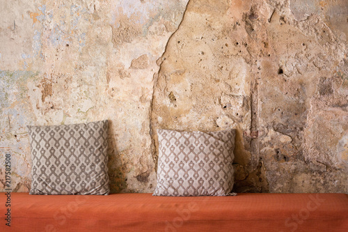 Pillows on a red cloth sofa
