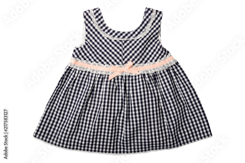 Clothes for children. A black and white checkered dress with pink loop isolated on white background. Children fashion.