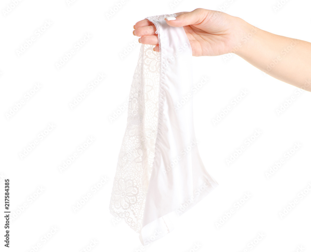 The white female panties in hand lace on white background isolation The white female panties in hand lace on white background isolation