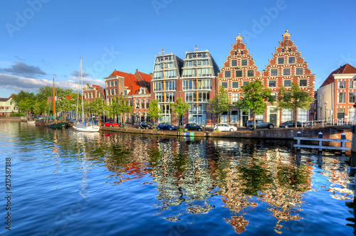 Houses reflection in Haarlem canals, Netherlands photo