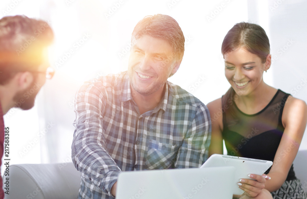 Male executive interacting with his colleague in office Male executive interacting with his colleague in office