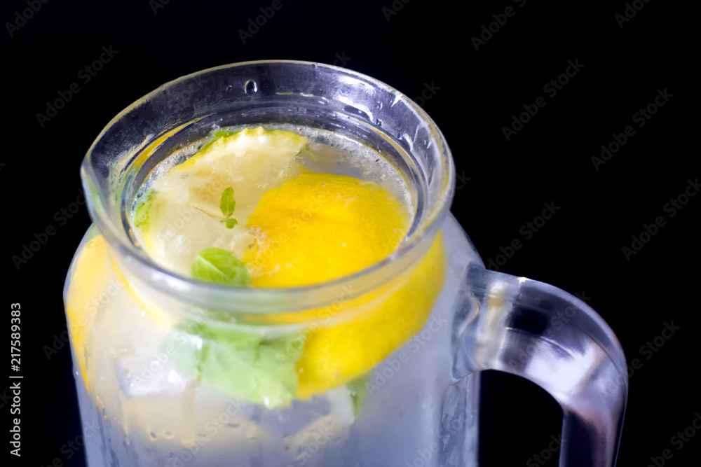 Cold lemonade with lemon close up. Cold lemonade with lemon close up.