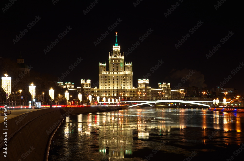 Night view of Moskvoretskaya embankment and high-rise building on Kotelnicheskaya embankment, Moscow, Russia