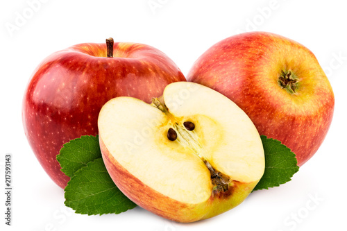 Red apples and a half with green leaves close-up on a white. Isolated.