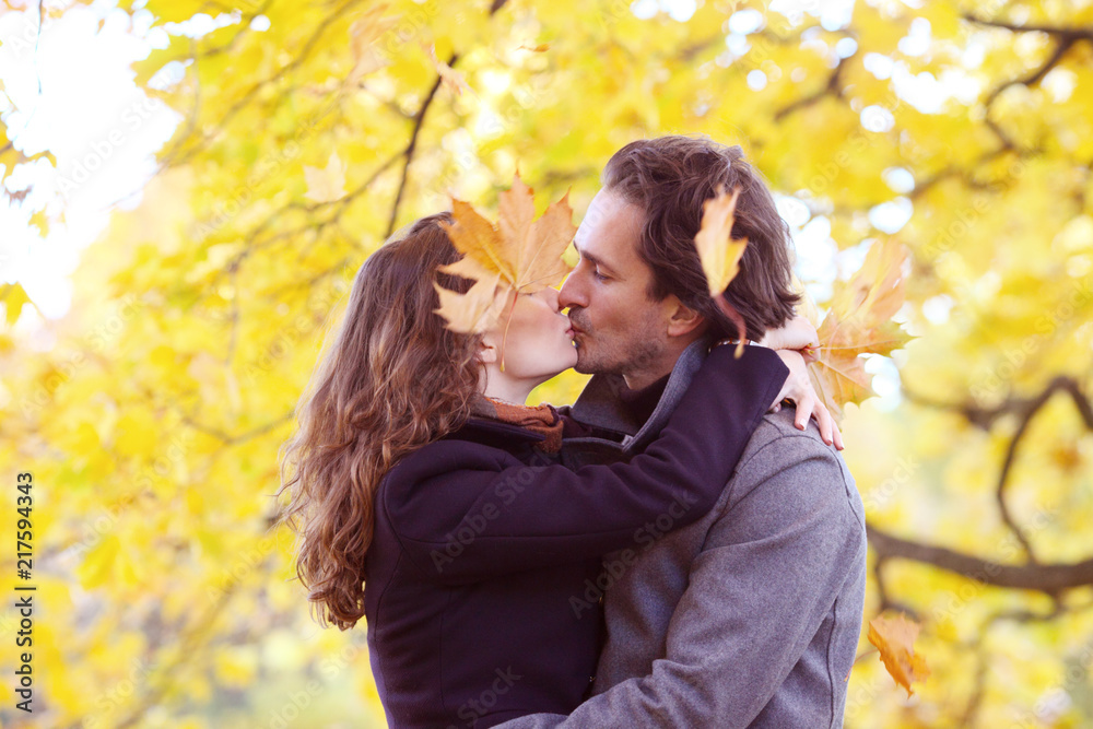 Couple kissing in autumn forest Couple kissing in autumn forest