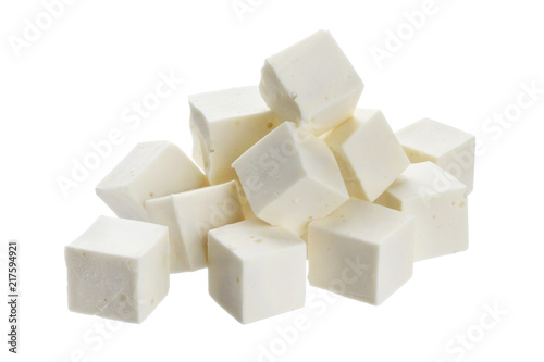 Heap of diced feta cubes isolated on white background