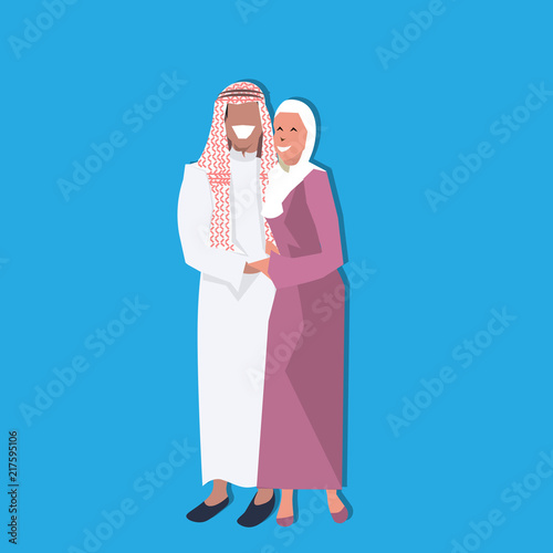 Arabic couple standing together wearing traditional clothes happy arab man woman cartoon character avatar blue background flat full length vector illustration