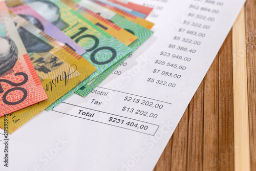 Australian dollars on purchasing order on wooden background