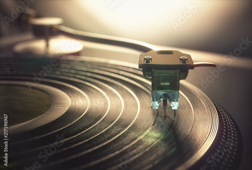 Vinyl record being played on old retro vintage disc jockey device.