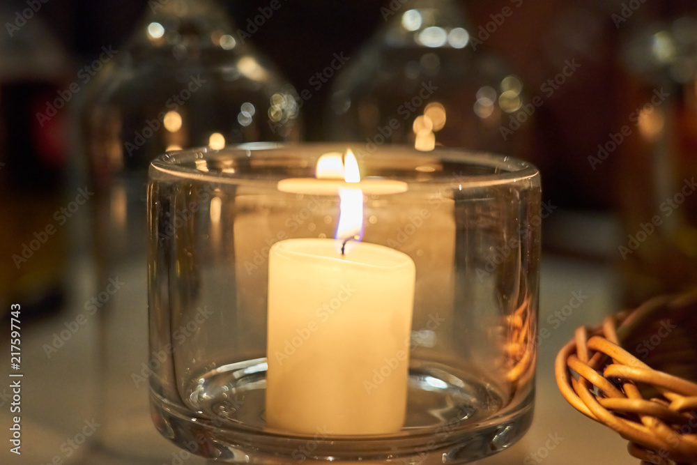Candle on a table with blurred background bokeh. Candle on a table with blurred background bokeh.