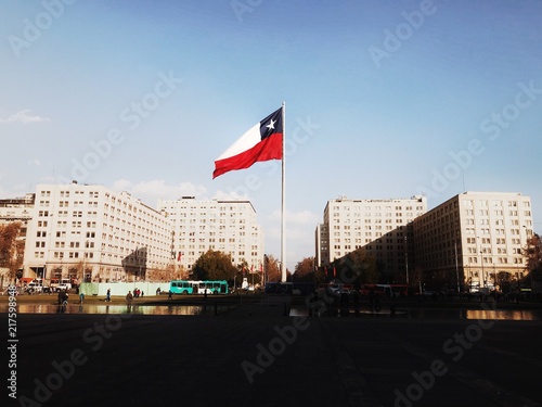 The Chilean flag flies outside the Presidential Palace in Santiago
