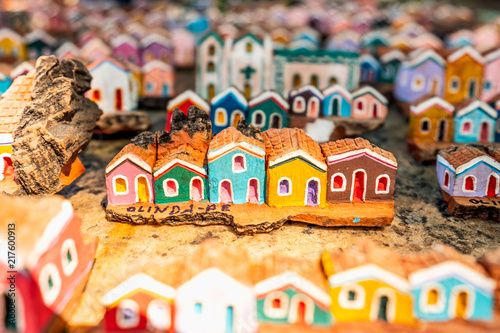Olinda, Pernambuco, Brazil - JUL, 2018: Little wooden carvings representing the colorful houses and architecture of Olinda photo