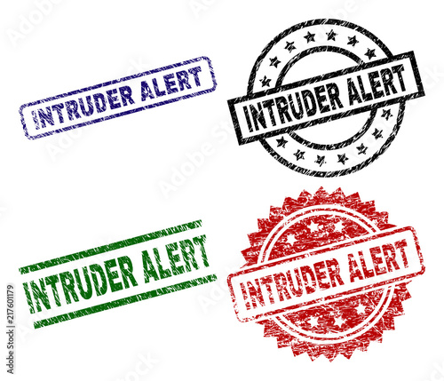 INTRUDER ALERT seal stamps with damaged texture. Black, green,red,blue vector rubber prints of INTRUDER ALERT tag with unclean texture. Rubber seals with circle, rectangle, medallion shapes.