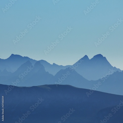 Silhouettes of mountain peaks seen from Mount Niesen. Bernese Oberland. 