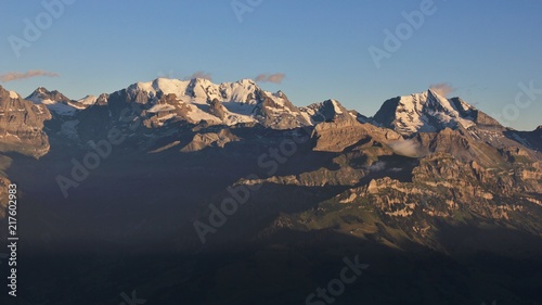 High mountains in the Bernese Oberland at sunset. Bluemlisalp Range and Mount Doldenhorn.
