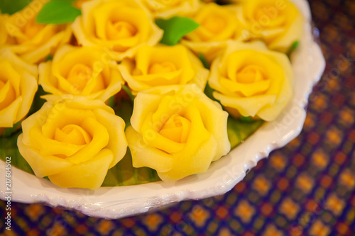 Yellow Rose Allure or Alua, modern approach Thai style dessert made from flour. Concept style for Food Styling, creative plating, decorating presentation idea, arrangement for party, catering, banquet photo