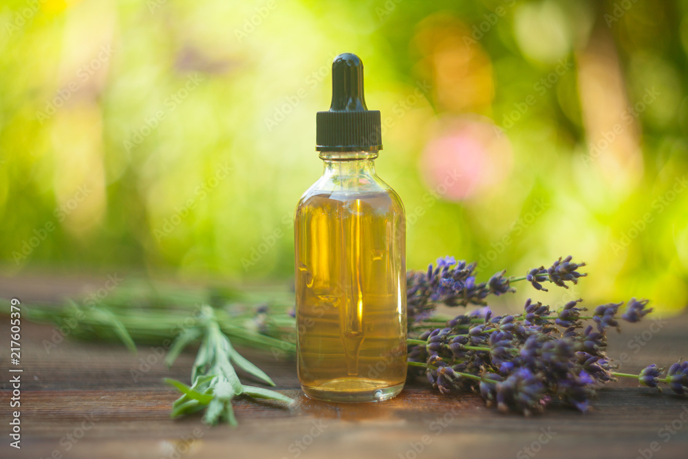 lavender essential oil in beautiful bottle on table lavender essential oil in beautiful bottle on table