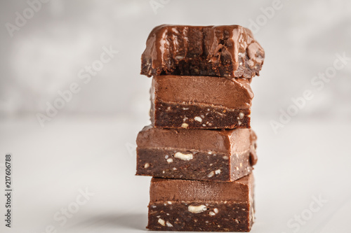 Fényképezés Stack of chocolate fudge bars on white background