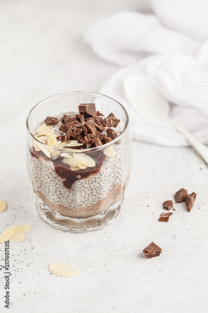 Chia pudding with chocolate, almonds and berry jam. Raw vegan dessert. Chia pudding with chocolate, almonds and berry jam. Raw vegan dessert.