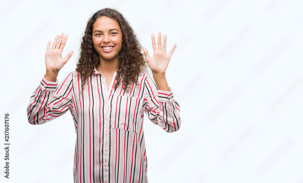 Beautiful young hispanic woman showing and pointing up with fingers number ten while smiling confident and happy. Beautiful young hispanic woman showing and pointing up with fingers number ten while smiling confident and happy.