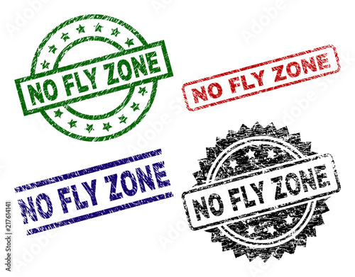 NO FLY ZONE seal prints with corroded surface. Black, green,red,blue vector rubber prints of NO FLY ZONE title with dirty surface. Rubber seals with circle, rectangle, medallion shapes.