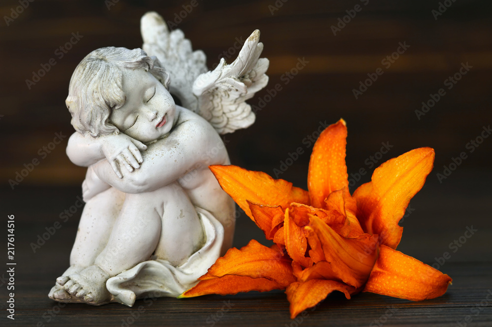 Angel guardian and lily flower