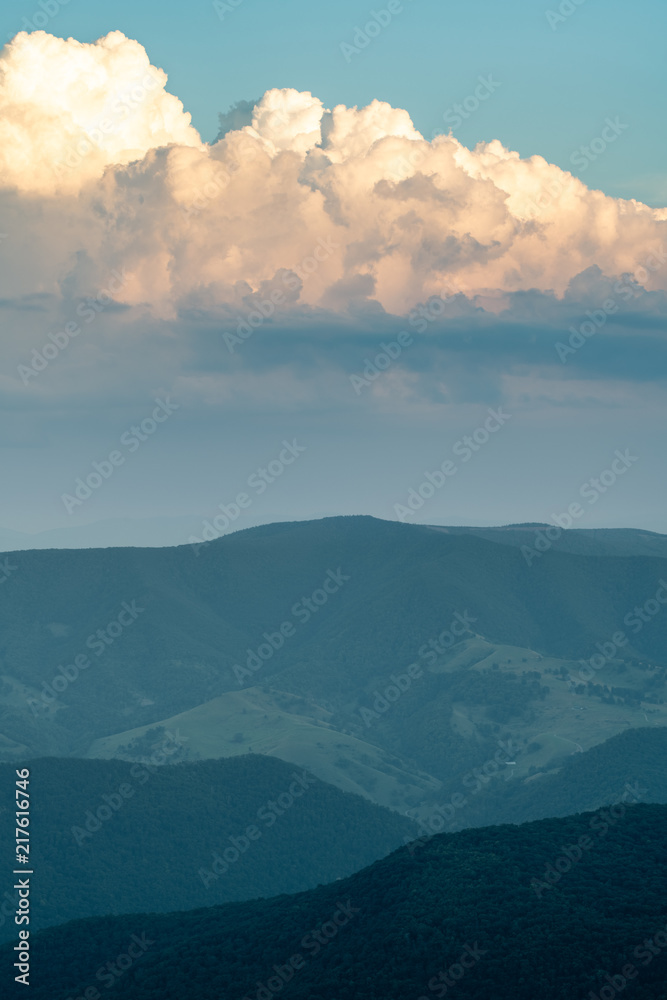 A dramatic sunset viewed from Spruce Knob West Virginia in the Appalachian Mountains looking down on hills in the surrounding valleys