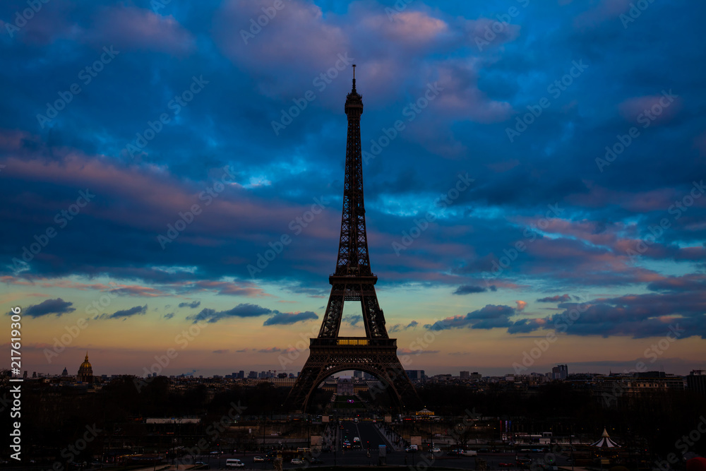 Tour Eiffel the most  famous Parisian icon at sunsent seen from Trocadero in a freezing winter day just before spring