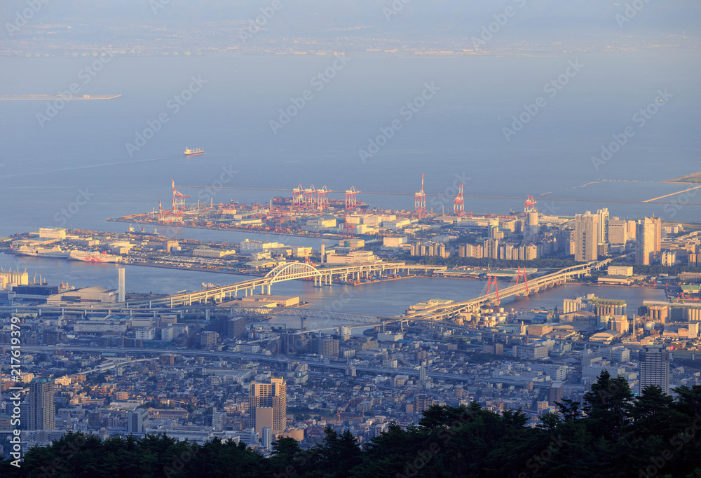 Kobe, Japan - August 8, 2018: Bridges lead from Kobe city to one of many man-made industrial islands in Osaka Bay