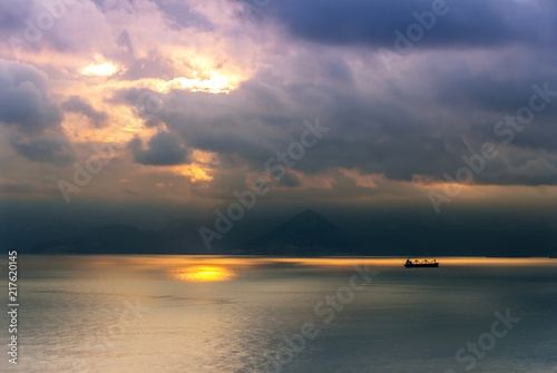 Antalya, Turkey, 20 December 2010: Gulf of Antalya with clouds and sunset photo