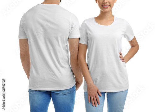 Young couple in t-shirts on white background. Mockup for design