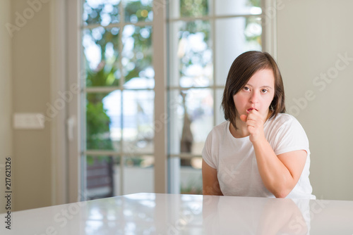 Free Download Down syndrome woman at home feeling unwell and coughing as symptom for cold or bronchitis. Healthcare concept. - GFXLoad