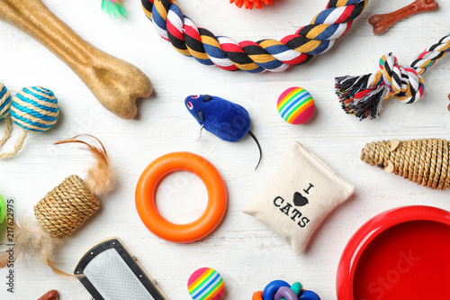 Fototapeta Naklejka Na Ścianę i Meble -  Flat lay composition with accessories for dog and cat on wooden background. Pet care