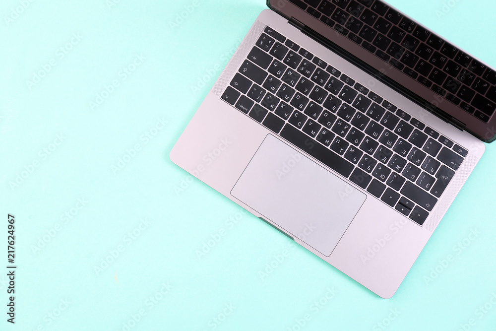 Modern laptop on color background, top view Modern laptop on color background, top view