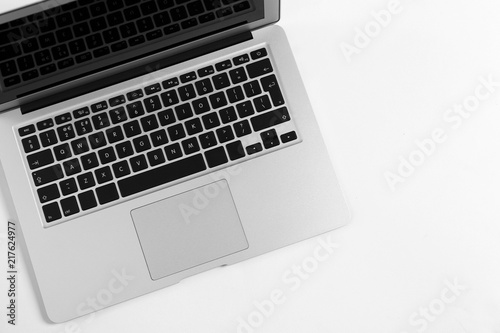 Modern laptop on light background, top view
