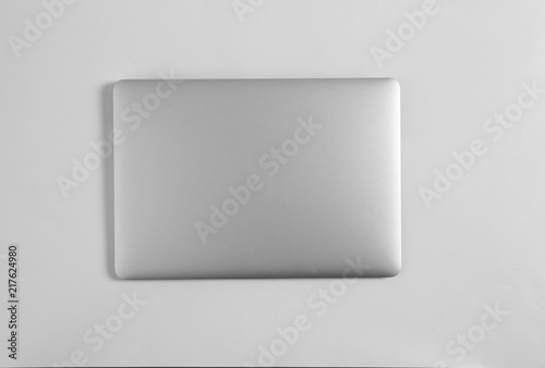 Fotografie Modern laptop on light background, top view