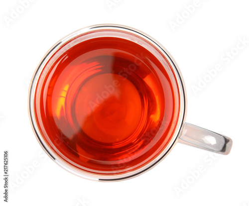 Glass cup of black tea on white background, top view