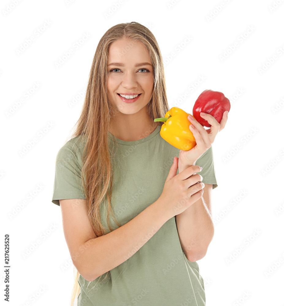 Young woman with peppers on white background. Healthy diet